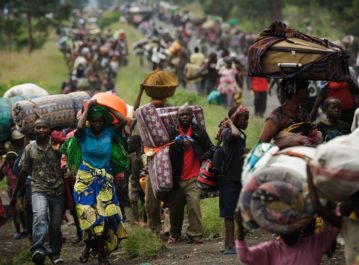 To escape fighting, thousands of civilians flee the town of Sake in the eastern part of the Democratic Republic of the Congo on Thursday. Rebels captured Sake and made other advances in the area this week.